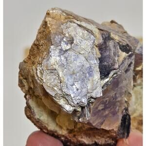 Raw Lepidolite on a stone
